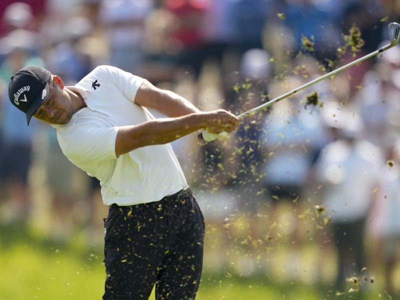 Xander Schauffele hits from the fairway on the 17th hole during the first round of the PGA Championship golf tournament at the Valhalla Golf Club