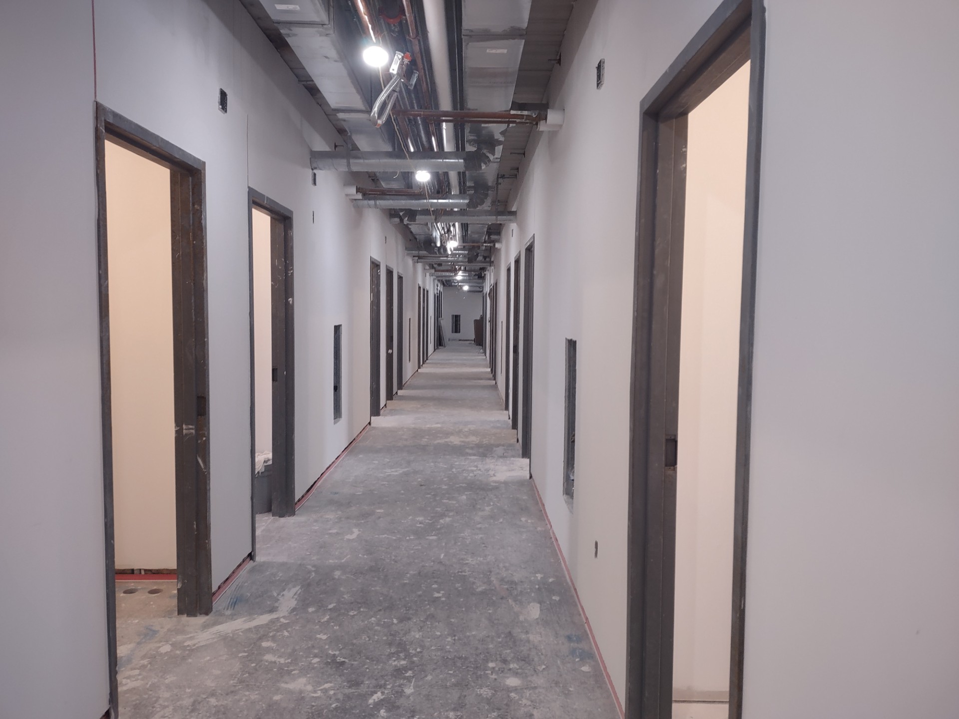 PH Drywalled Hallway.jpg This floor of Prefontaine Hall is starting to look more like the final product.