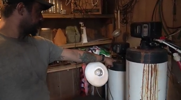 Roy New's water filter tanks with contaminated water.